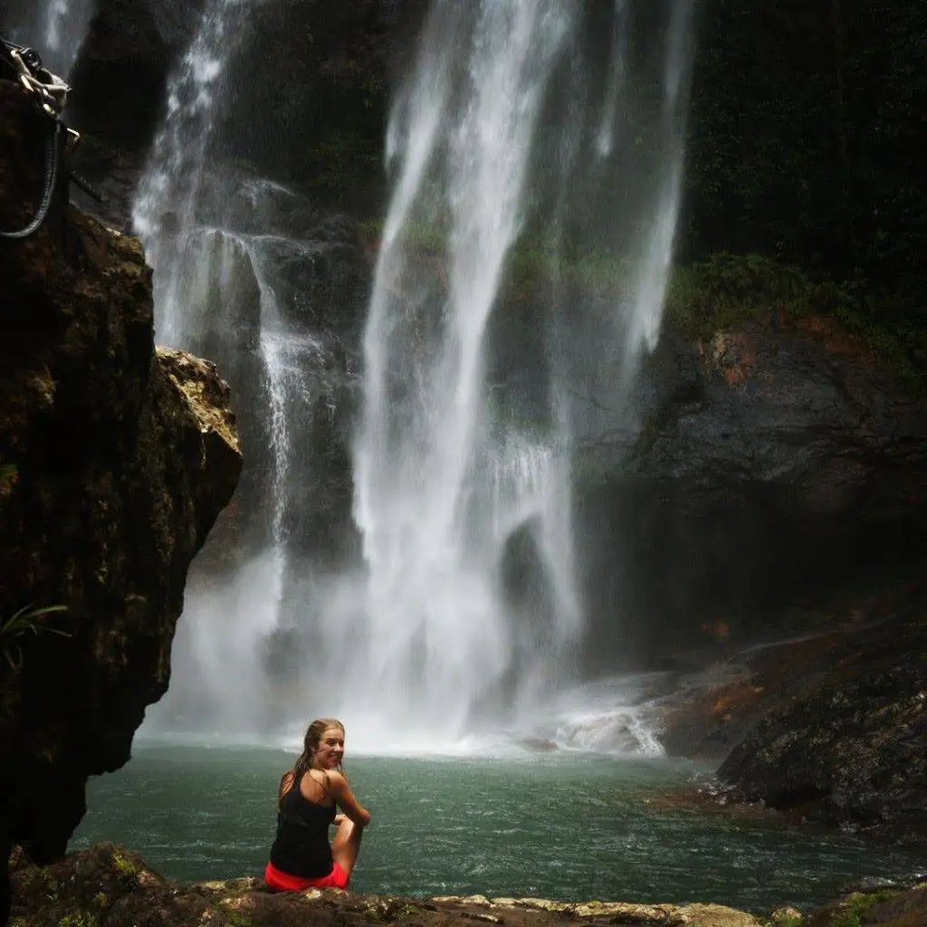 Tropical waterfall in the jungle of Flores, Indonesia, on a slow travel route through the Ngada region