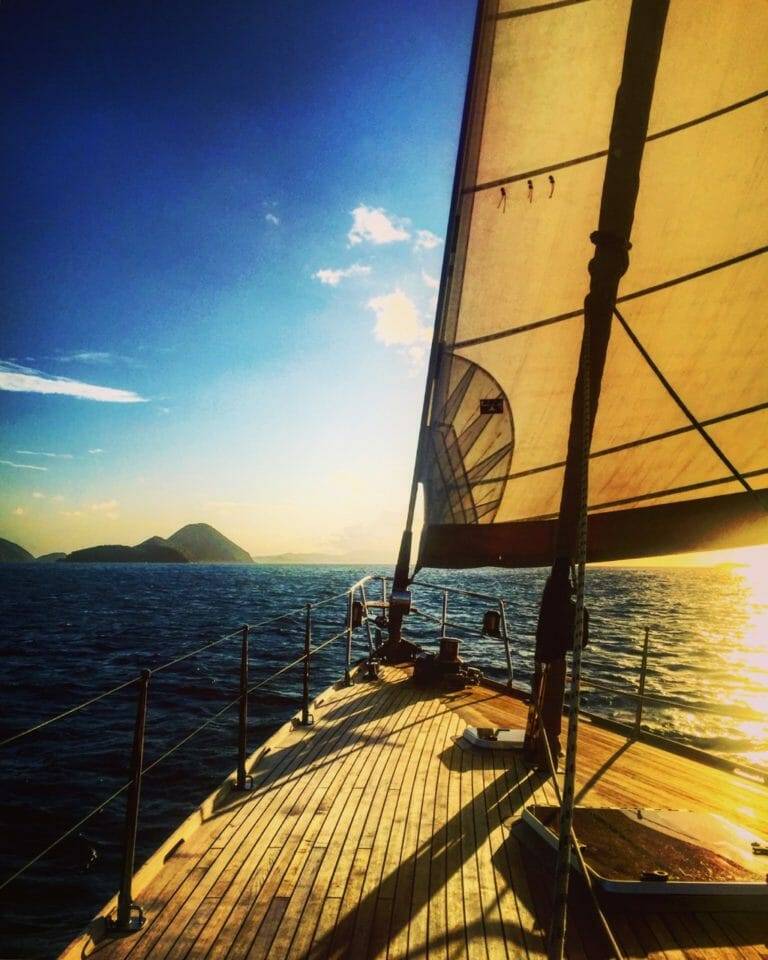 a sail boat in the ocean.