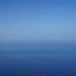 a view of the ocean from an airplane.