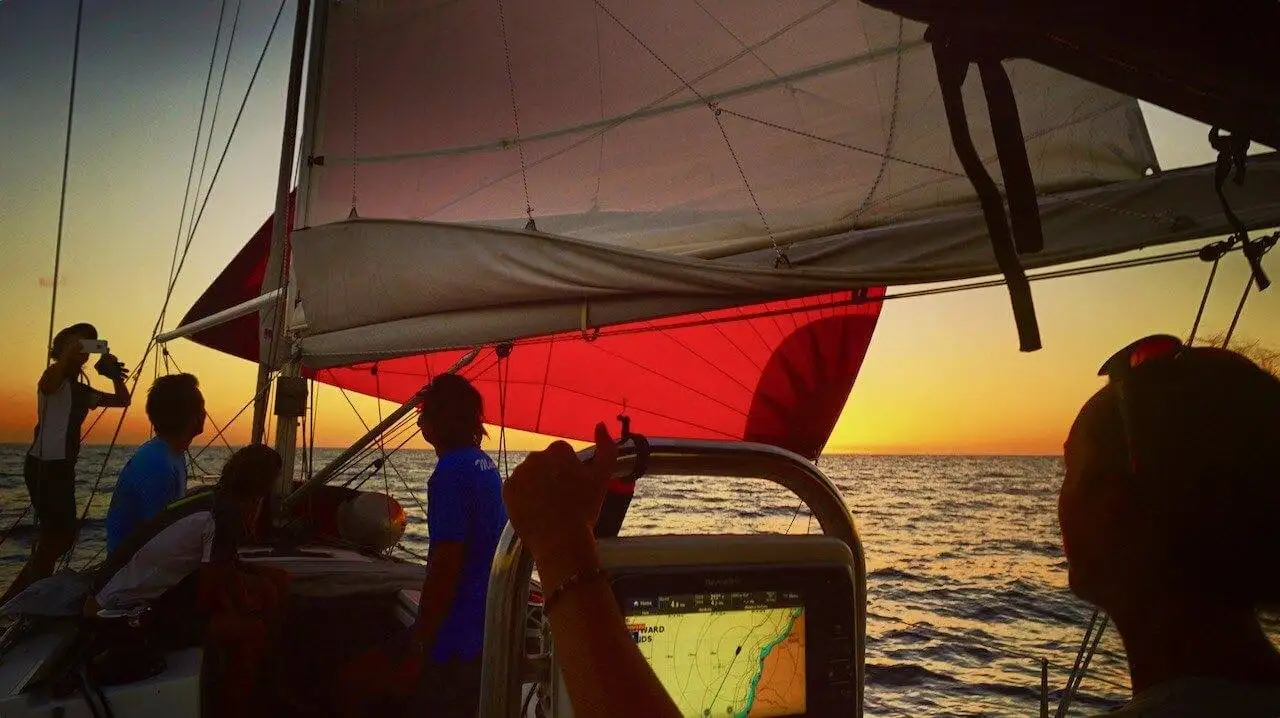 Ocean Nomads sailing together at sunset