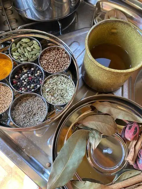 My masala dabba spice tin on the stove in my campervan