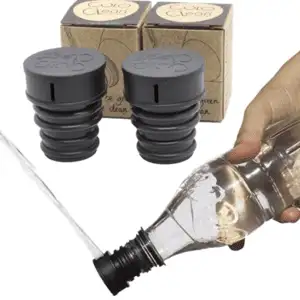 a person is pouring a bottle of wine into a bottle opener.