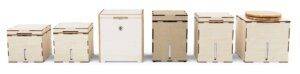Five different styles of modern wooden beehives isolated on a white background.