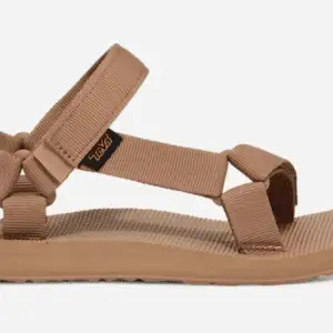 A pair of Teva Sandals with multiple tan webbing straps, an adjustable ankle strap, and a flat sole is displayed against a white background. The sandals also feature a small logo tag near the ankle.