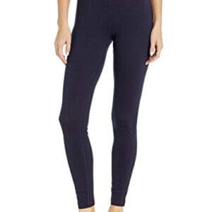 A person stands barefoot wearing fitted, dark-colored leggings with a visible waistband that reads "icebreaker" on a plain background.