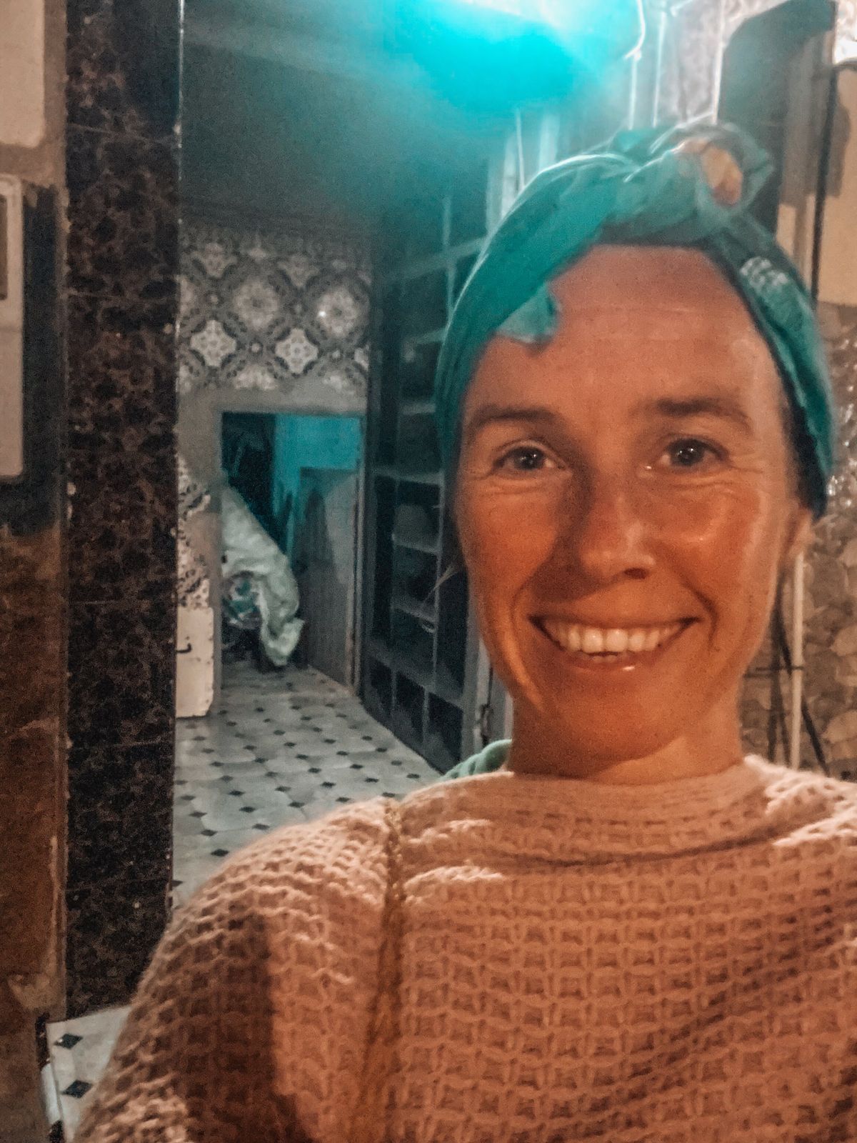 Suzanne smiling with a scarf on her head after a visit to the hammam in Morocco