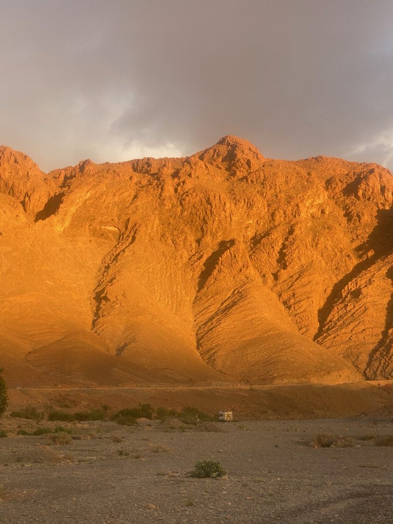 Red mountains under a grey winter sky in Morocco