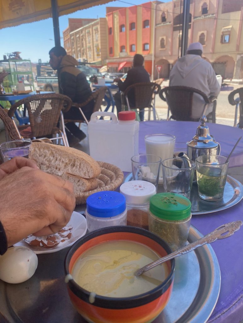 A bowl of warm soup with bread at a street café in Morocco