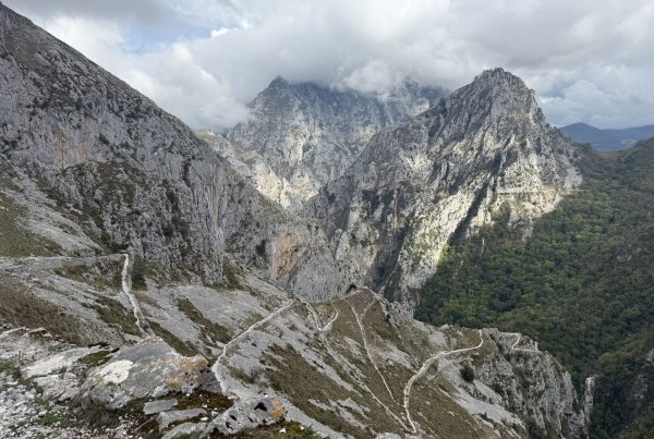 A zigzag trail below the limestone peaks of the Picos de Europa